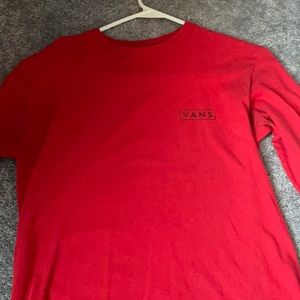 Red long sleeve Vans shirt.